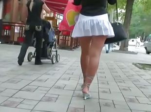 That marvelous butt in skirt drives any voyeur crazy